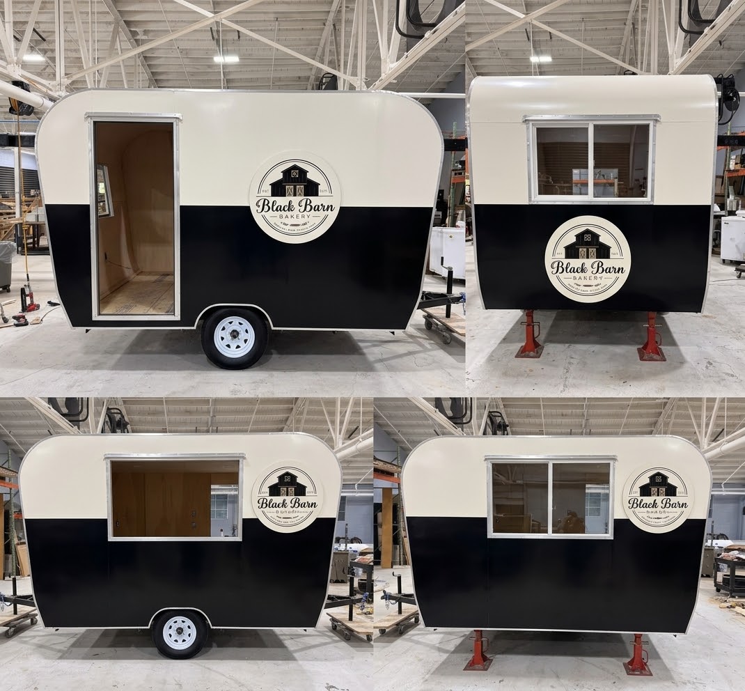 Black Barn Bakery trailer — entry door and wood interior