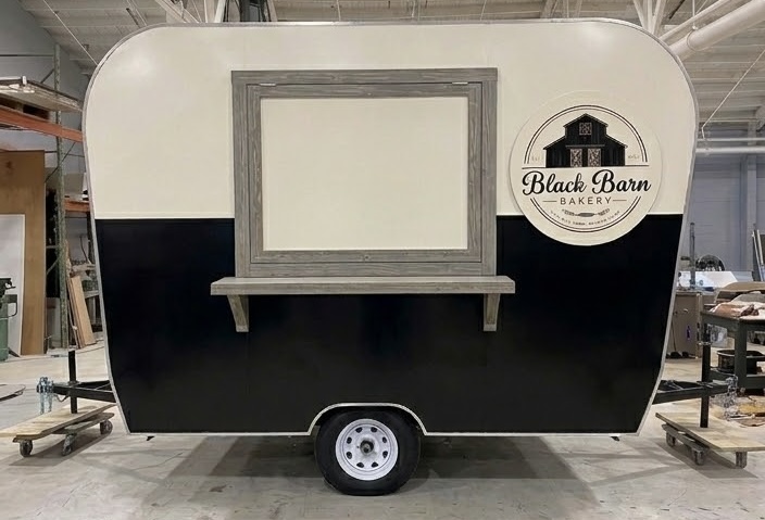Black Barn Bakery retro trailer — service window side