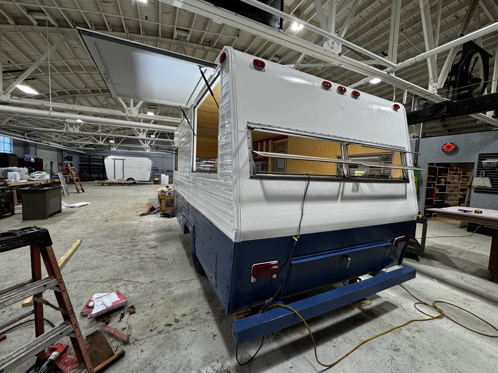 Rear quarter of the painted trailer with the service hatch open